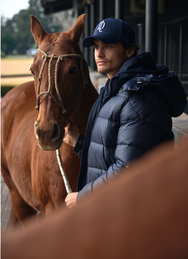 La Dolfina rider beside a polo horse